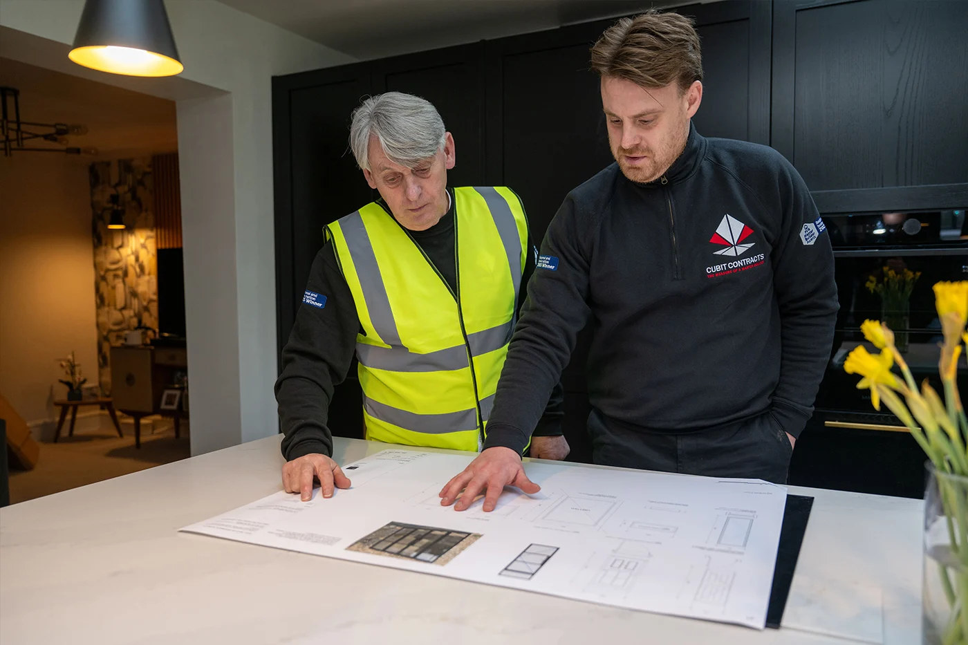 cubit contracts team looking over house extension drawings